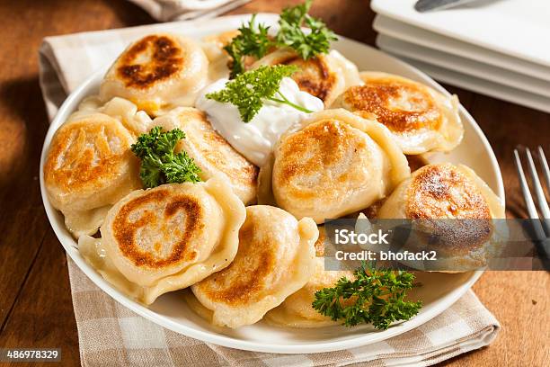 Homemade Polish Pierogis With Sour Cream Stock Photo - Download Image Now - Pierogi, Polish Culture, Food