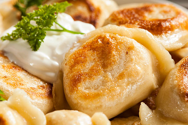 istock Homemade Polish Pierogis with Sour Cream 486978331