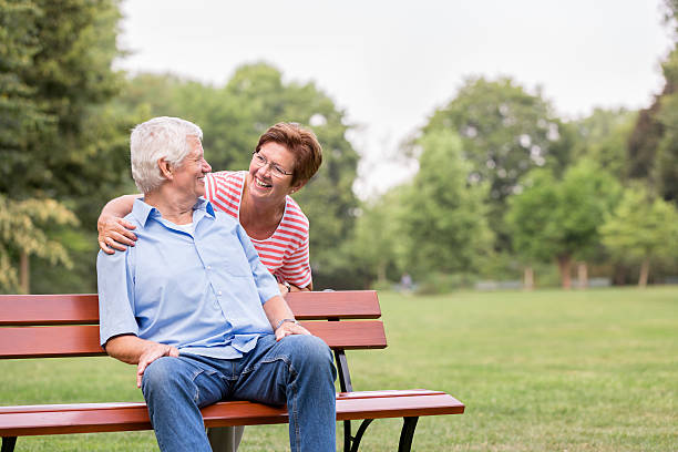 istock Senior couple on park bench 486981458
