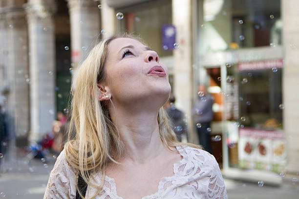 istock Blowing bubbles in the street 486981628