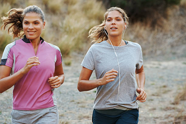 A bit of friendly competition between sisters never hurt! Shot of twin sisters out for a trail runhttp://195.154.178.81/DATA/i_collage/pu/shoots/805498.jpg never the same stock pictures, royalty-free photos & images