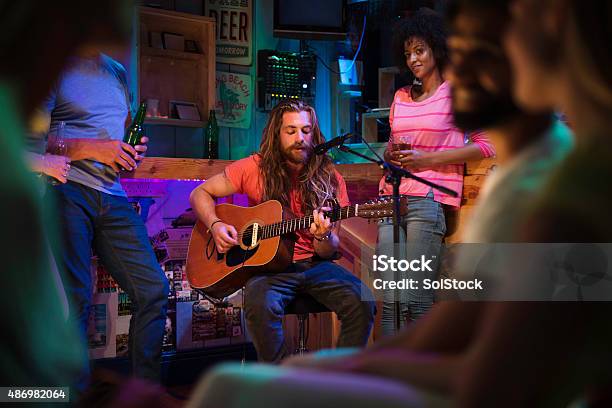 Singersongwriter Playing In Local Bar Stock Photo - Download Image Now - Music, Bar - Drink Establishment, Performance