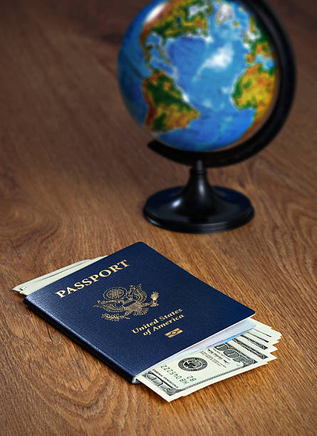 istock American passport and dollars 486984860