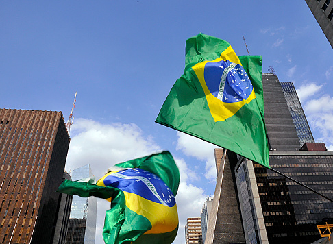 Brazilian flags fluttering on Avenida Paulista in Sao Paulo, Brazil.