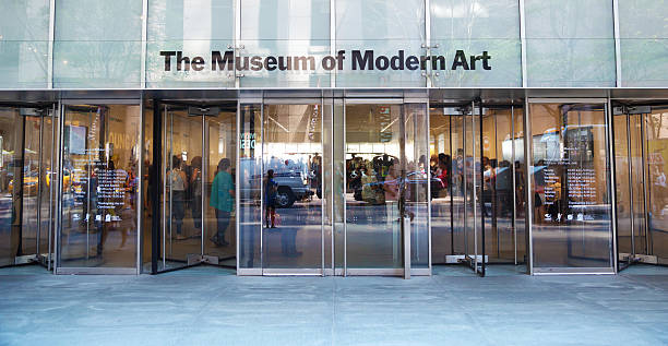 New York City, USA - August 10, 2015: the entrance of Museum of Modern Art from outside. Some people are visible in the internal hall.