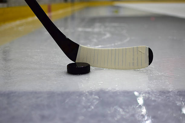 istock Ice hockey stick with puck 486993134