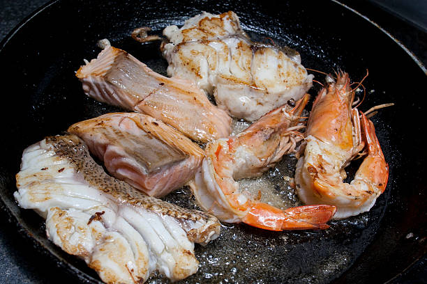istock fried seafood on frying pan 486994648