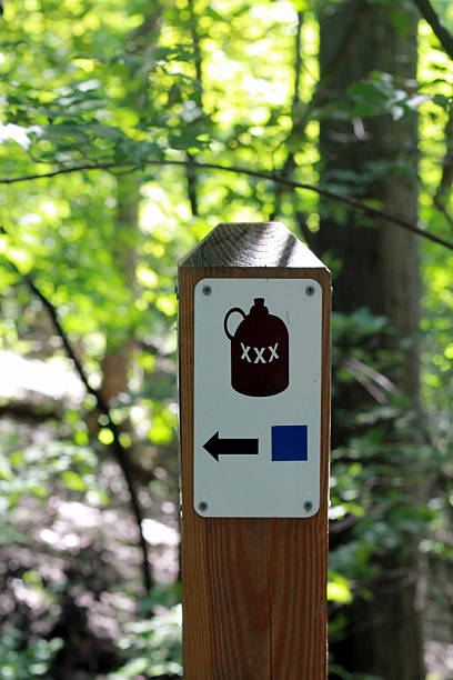 istock Sign with jug and XXX on a post 486995702