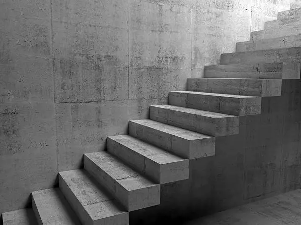 Photo of Abstract concrete interior with cantilevered stairs