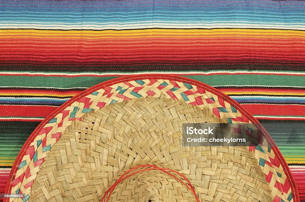 Regional2014 Mexico Sombrero and poncho stripe rug background and copyspace, dia de los muertos, cinco de mayo, day of the dead, Dia De Muertos Backgrounds Stock Photo