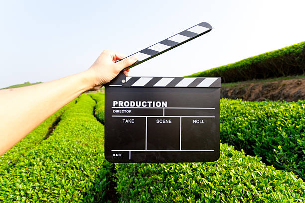 Hands holding a movie clapboard