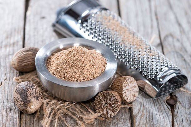 istock Small bowl with Nutmeg Powder 486999581