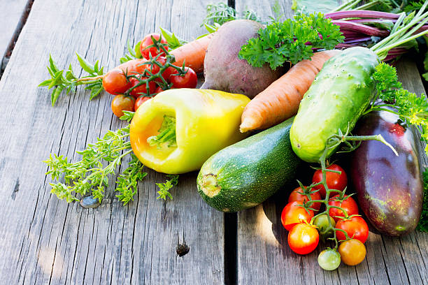istock Vegetables on a wooden background 486999714
