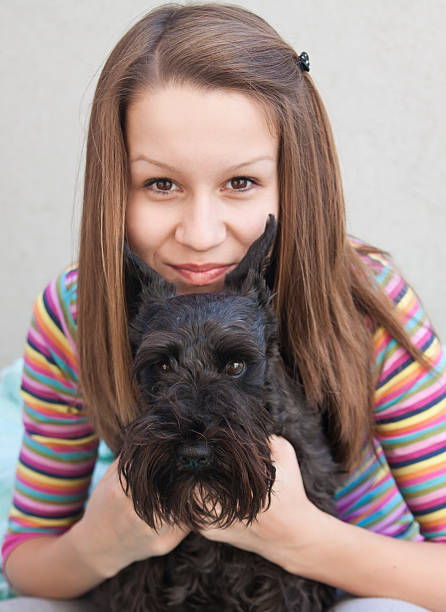 istock Young girl with her dog 486999949