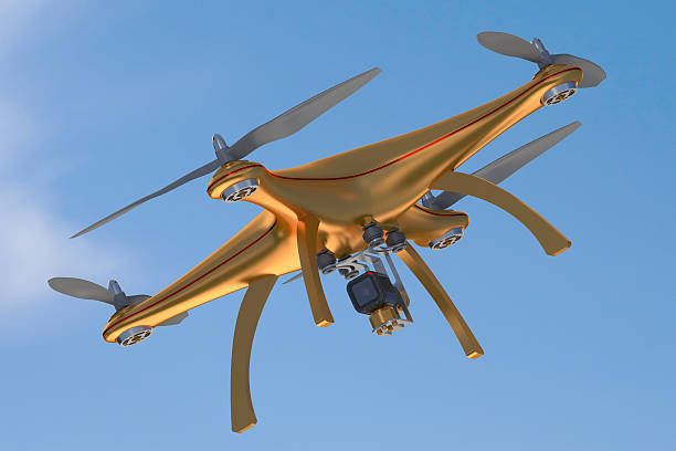 istock Gold drone flying in blue sky 487000274