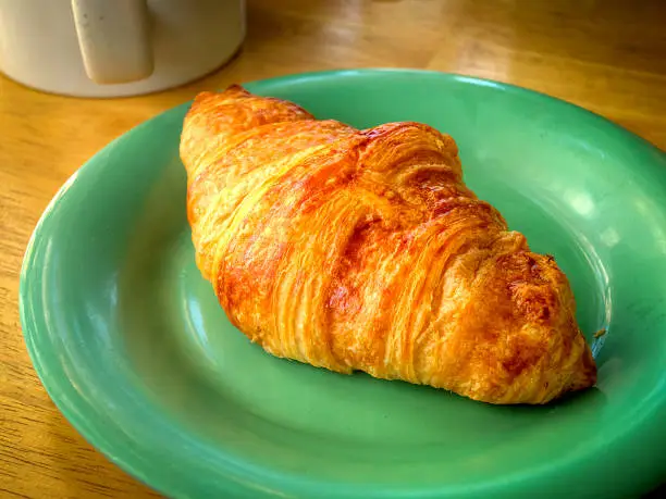 Photo of Poor’s man breakfast, just a croissant and a cup of coffee