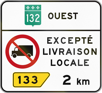 Canadian regulatory traffic sign - No lorries. The text means: 132 West - Except local delivery. This sign is used in Quebec.