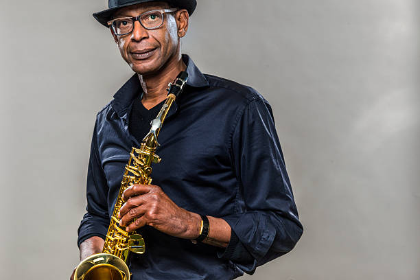 istock Musician with saxophone and big smile 487001370