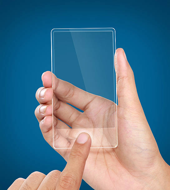 istock hands holding futuristic transparent mobile phone 487001379