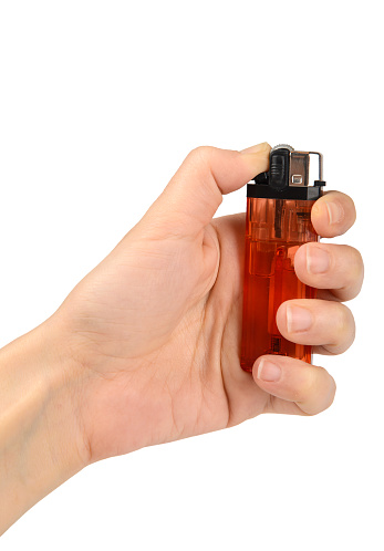 A Hand Holding Lighter On A White Background,