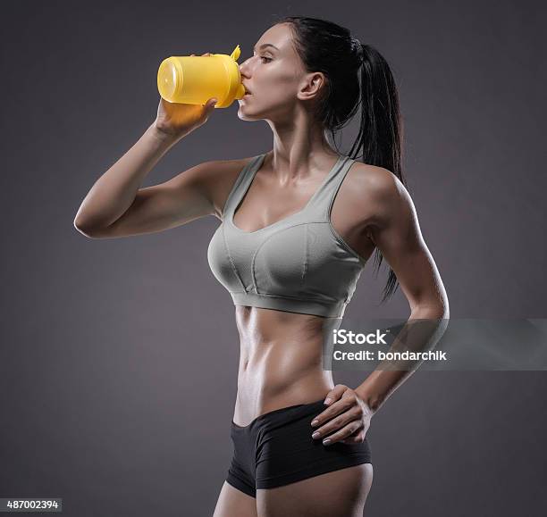 Athletic Young Woman Doing A Fitness Workout Stock Photo - Download Image Now - 2015, Abdominal Muscle, Activity