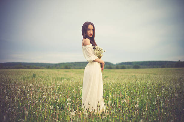 istock Beautiful woman in field 487003390