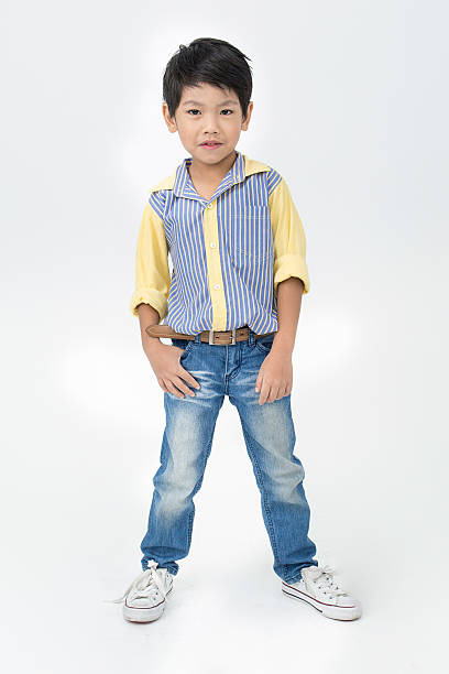 istock Little asian boy with smile face on gray background 487003746