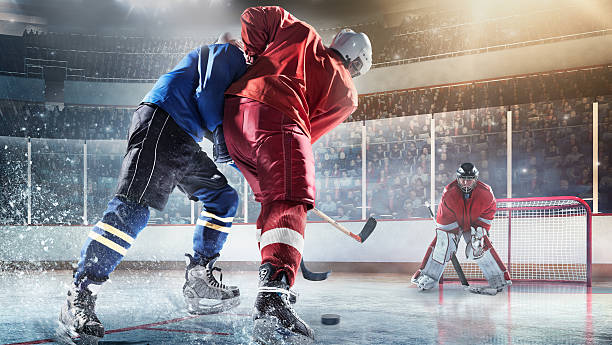 joueur de hockey sur glace des joueurs en action - ice hockey hockey puck playing shooting at goal photos et images de collection