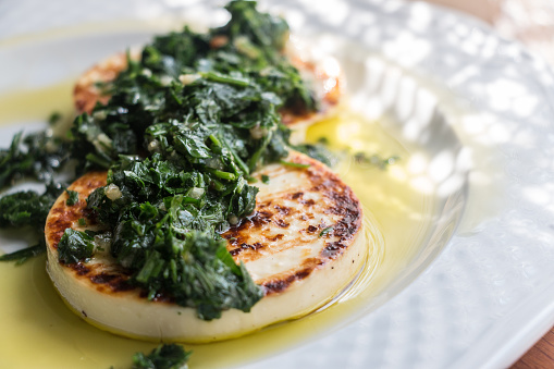 Halloumi cheese with parsley, onion and olive oil.