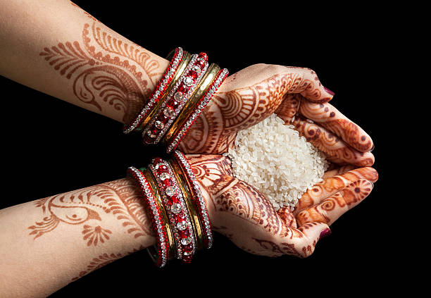 Indian hands with rice stock photo
