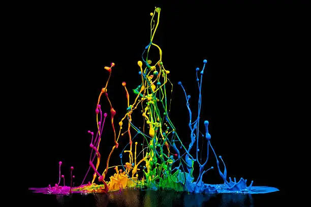 This is a colorful paint splash on a speaker isolated on a black background.
