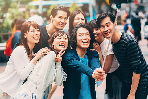 istock Happy japanese friends taking a selfie 487015240