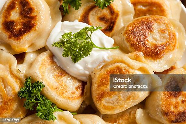 Homemade Polish Pierogis With Sour Cream Stock Photo - Download Image Now - Baked, Celebration, Cheese