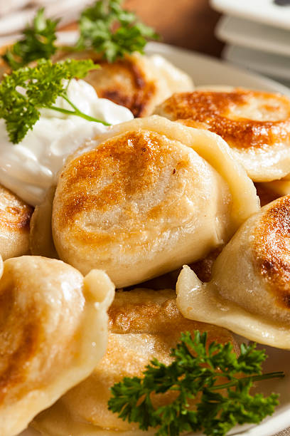 istock Homemade Polish Pierogis with Sour Cream 487016757