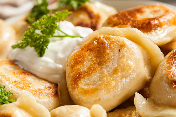 istock Homemade Polish Pierogis with Sour Cream 487016759