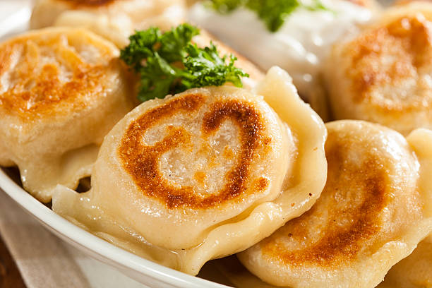 istock Homemade Polish Pierogis with Sour Cream 487016771