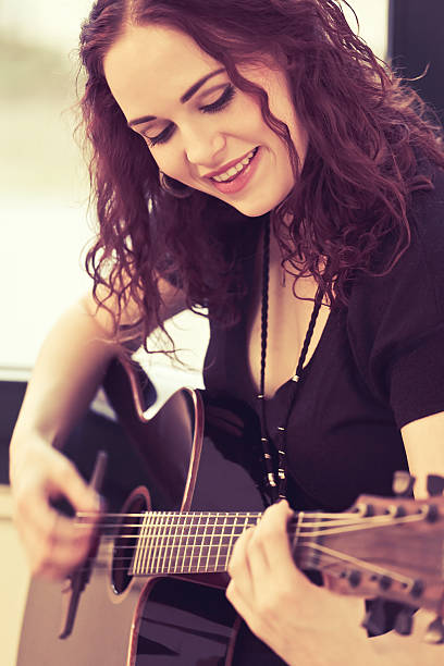 istock Smiling acoustic guitar player 487017299