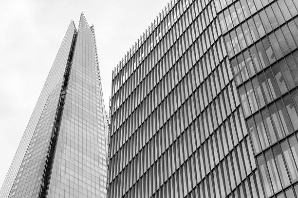 Low angle colour image depicting an abstract view of a modern architecture  apartment building built from glass and steel in the heart of the city of London, UK. Plenty of room for copy space.