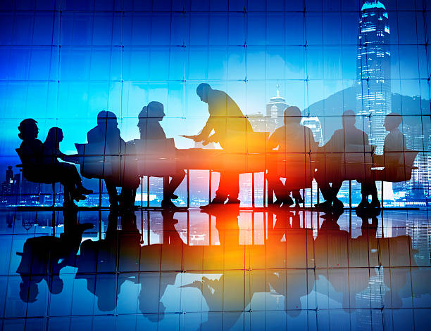 istock Back Lit Business People Discussion Cityscape Meeting Concept 487017918