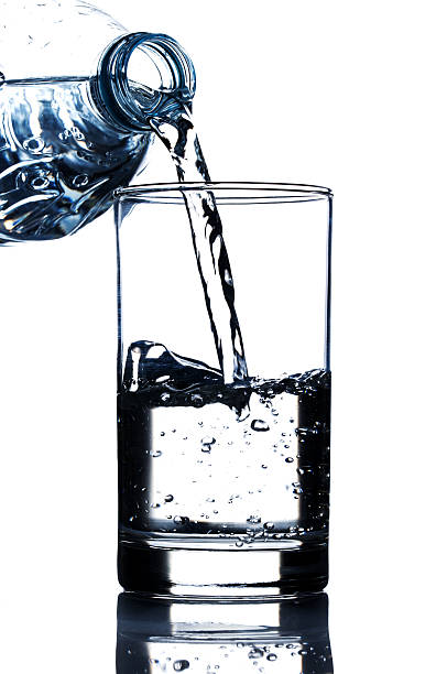 istock drinking water pouring in glass 487018267