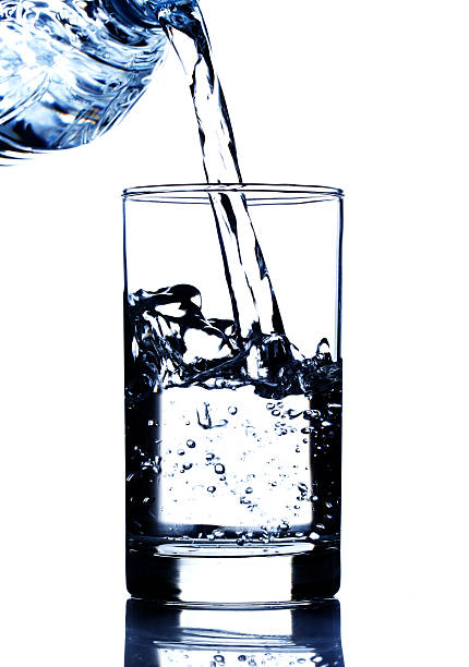 istock drinking water pouring in glass 487018279