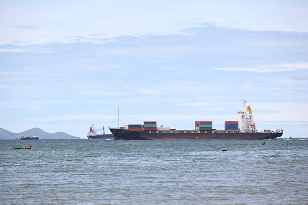 istock container ship in import,export port against beautiful  blue sky 487018442