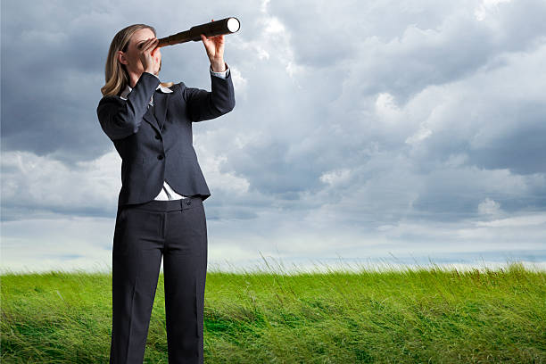 istock Businesswoman Looking Through A Spyglass 487021388