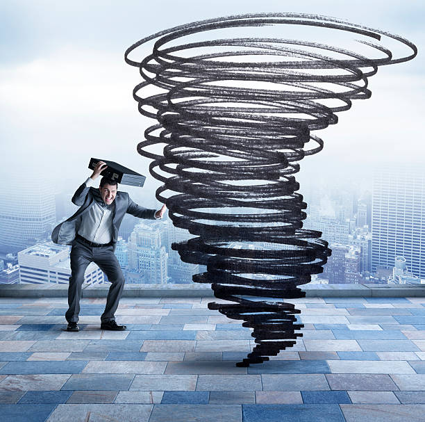 istock Businessman Protecting Himself From Tornado 487021398