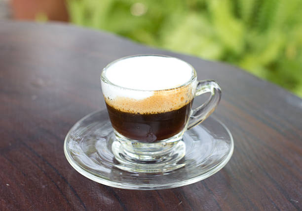 istock Hot  espresso with milk and foam in cup. 487021605