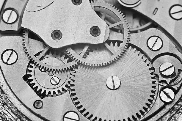 istock Black and white macro photo metal clockwork 487026860