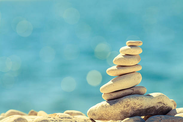 istock Stones pebbles balance at the beach, stack over blue sea 487028666