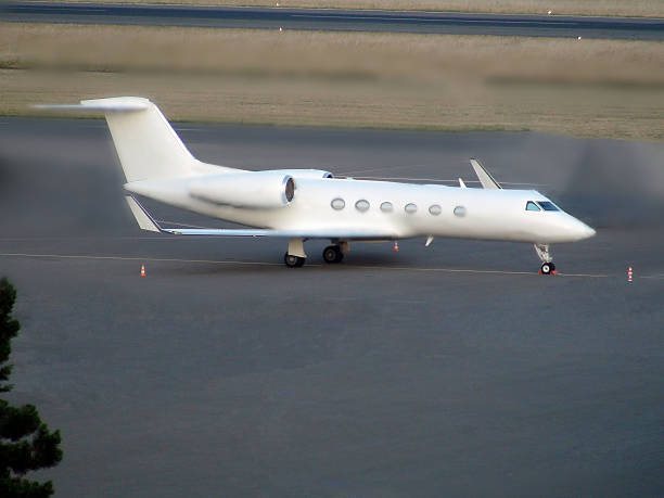 istock Looking At Luxury Private Jet At Airport 487031136