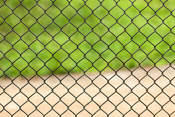 istock Road Behind the wire fence 487032458