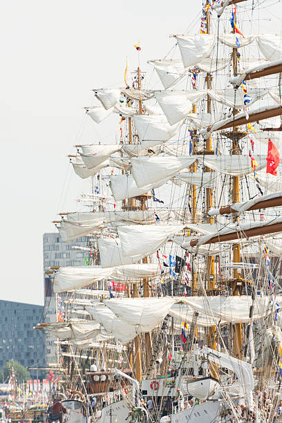 Low angle view of stairs against mast of sailing ship against clear sky, Hamburg harbor